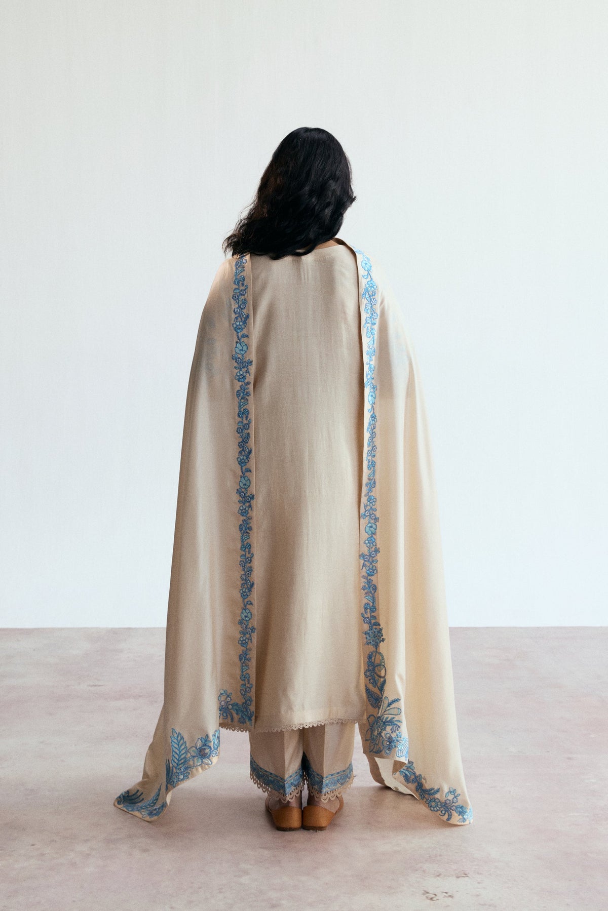 Back view of the Opalite Set highlighting the clean drape of the rayon shirt and raw silk trousers.