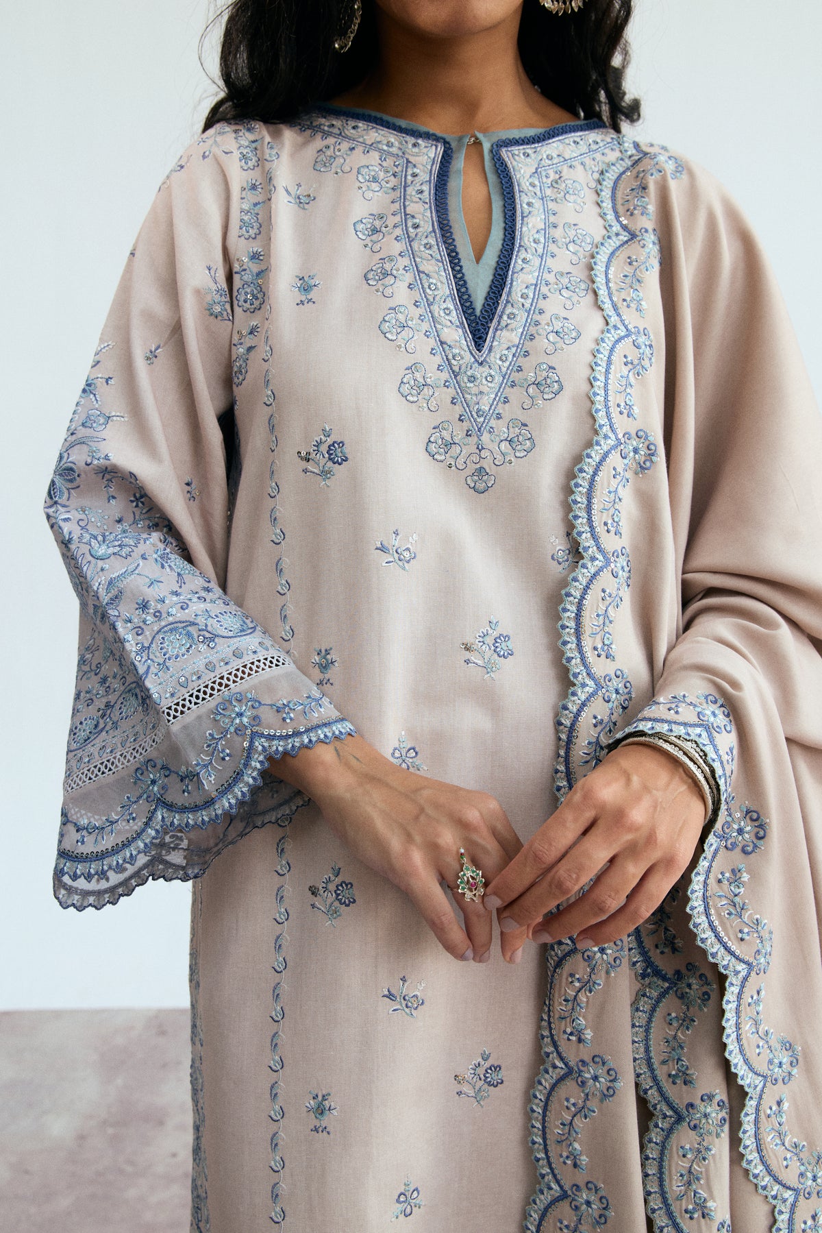 Winter Pakistani khaddar formal kameez in creamy oat with boat neckline, lace trimmings and looped lace accents — designer ethnic wear
