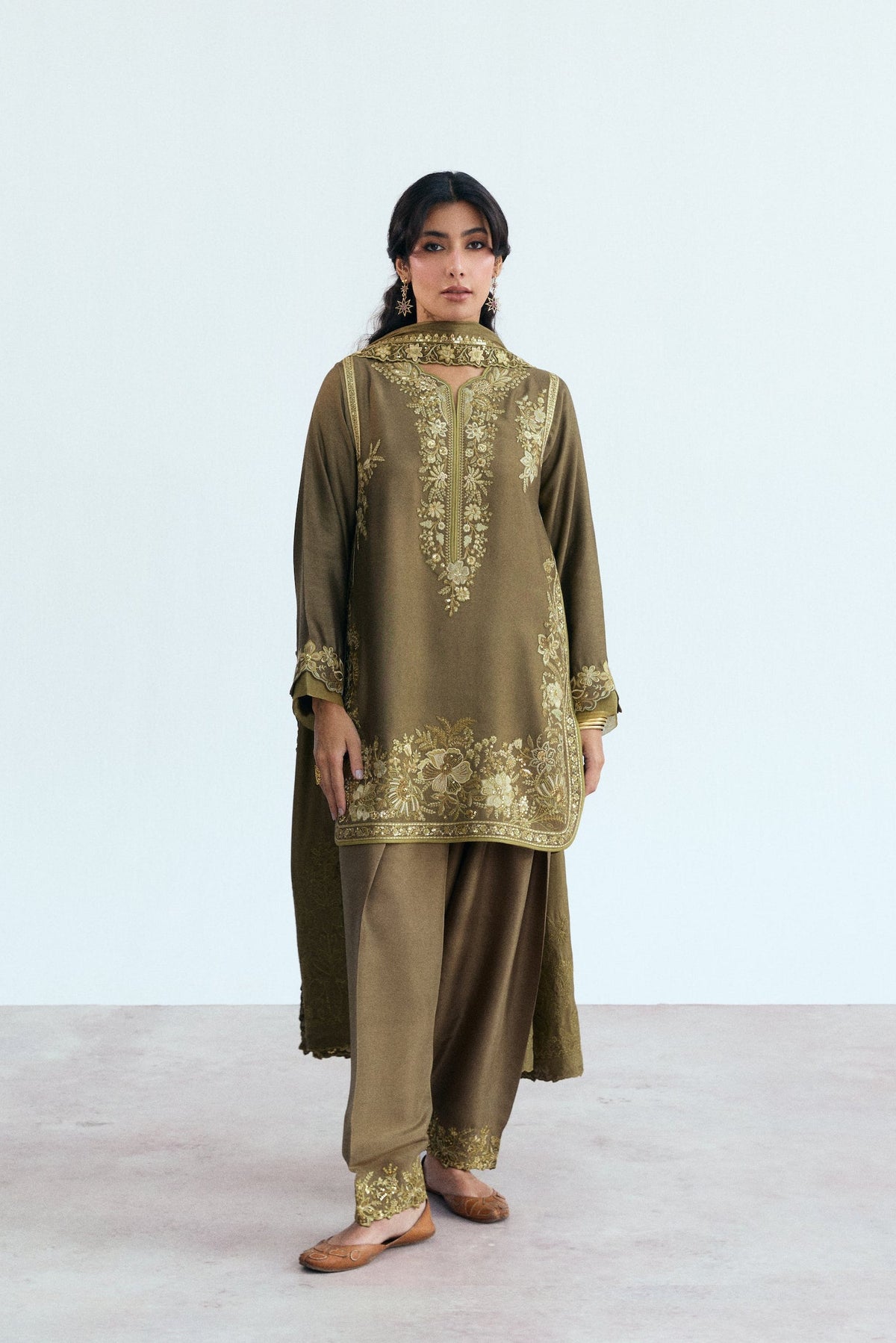 Mehndi green Pakistani salwar kameez with intricate hand-stitched sequin embroidery, full front view for festive UK occasion wear