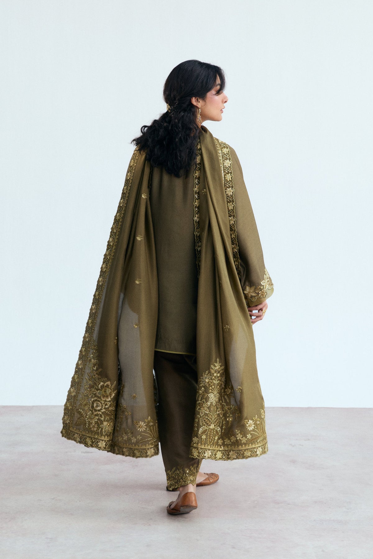 Back view of embellished rayon suit with sequin and embroidery detailing on dupatta and shalwar.