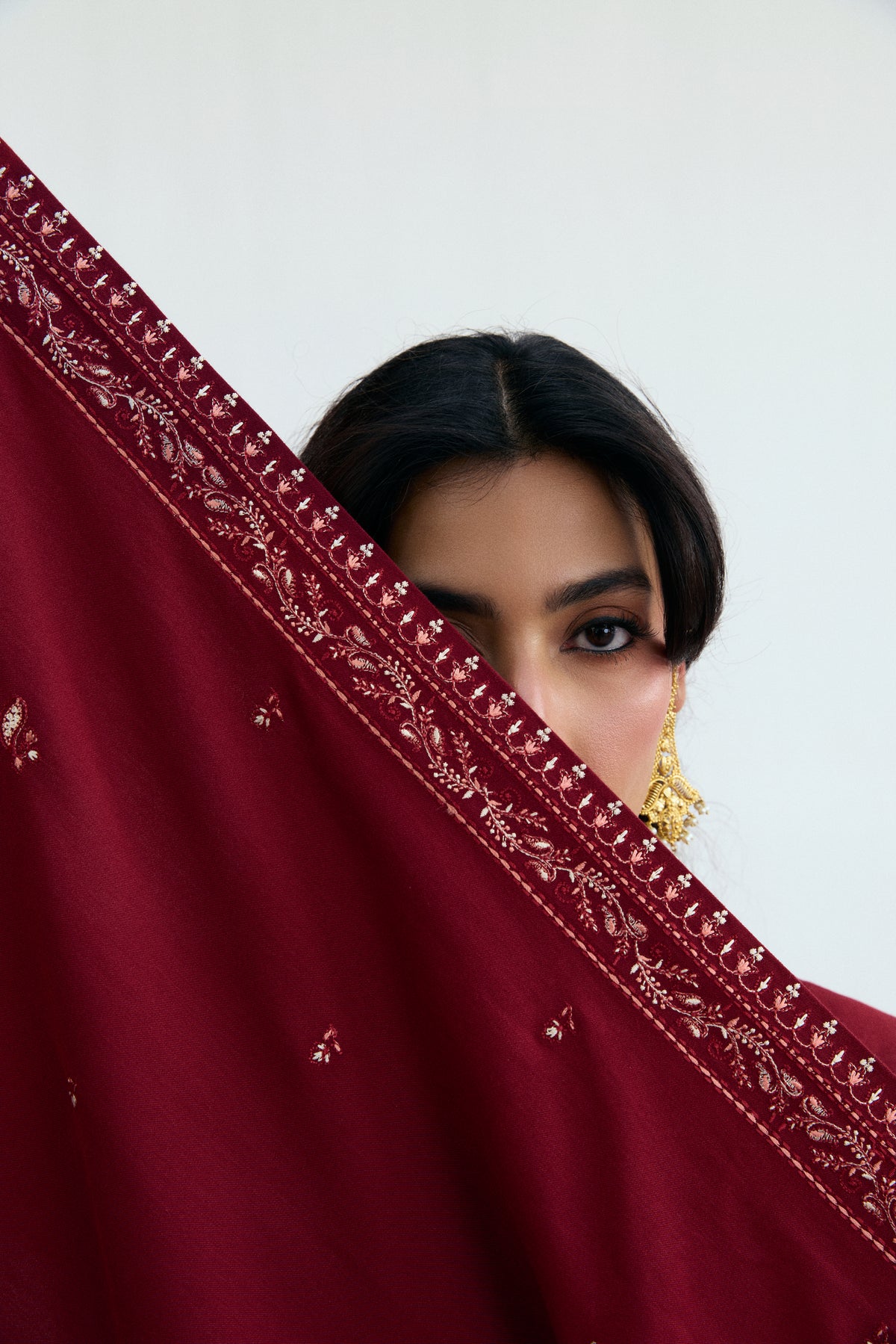 Garnet red Pakistani khaddar kameez with lace-finished sleeves and hem — formal and semi-formal winter occasion wear