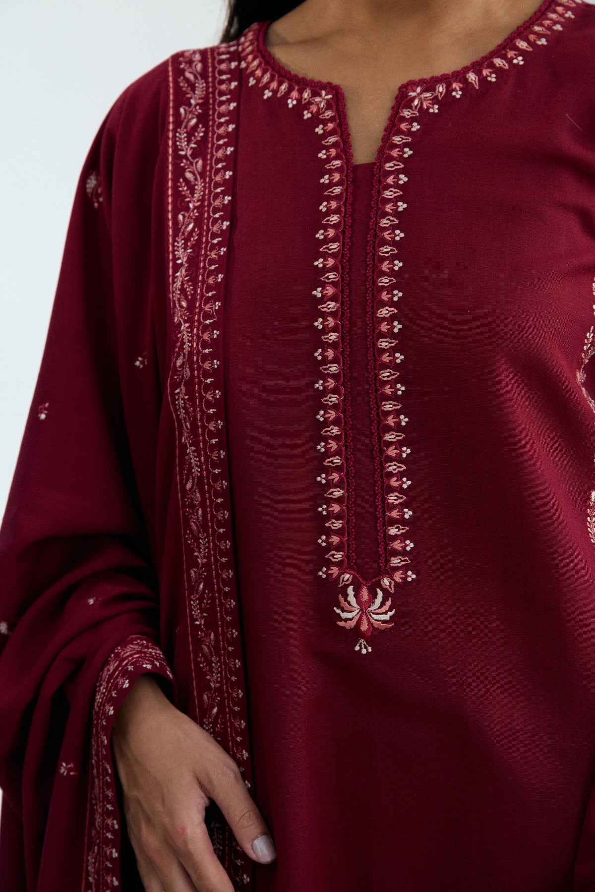Elegant deep red khaddar Pakistani semi-formal suit with tassel shawl — South Asian winter fashion UK