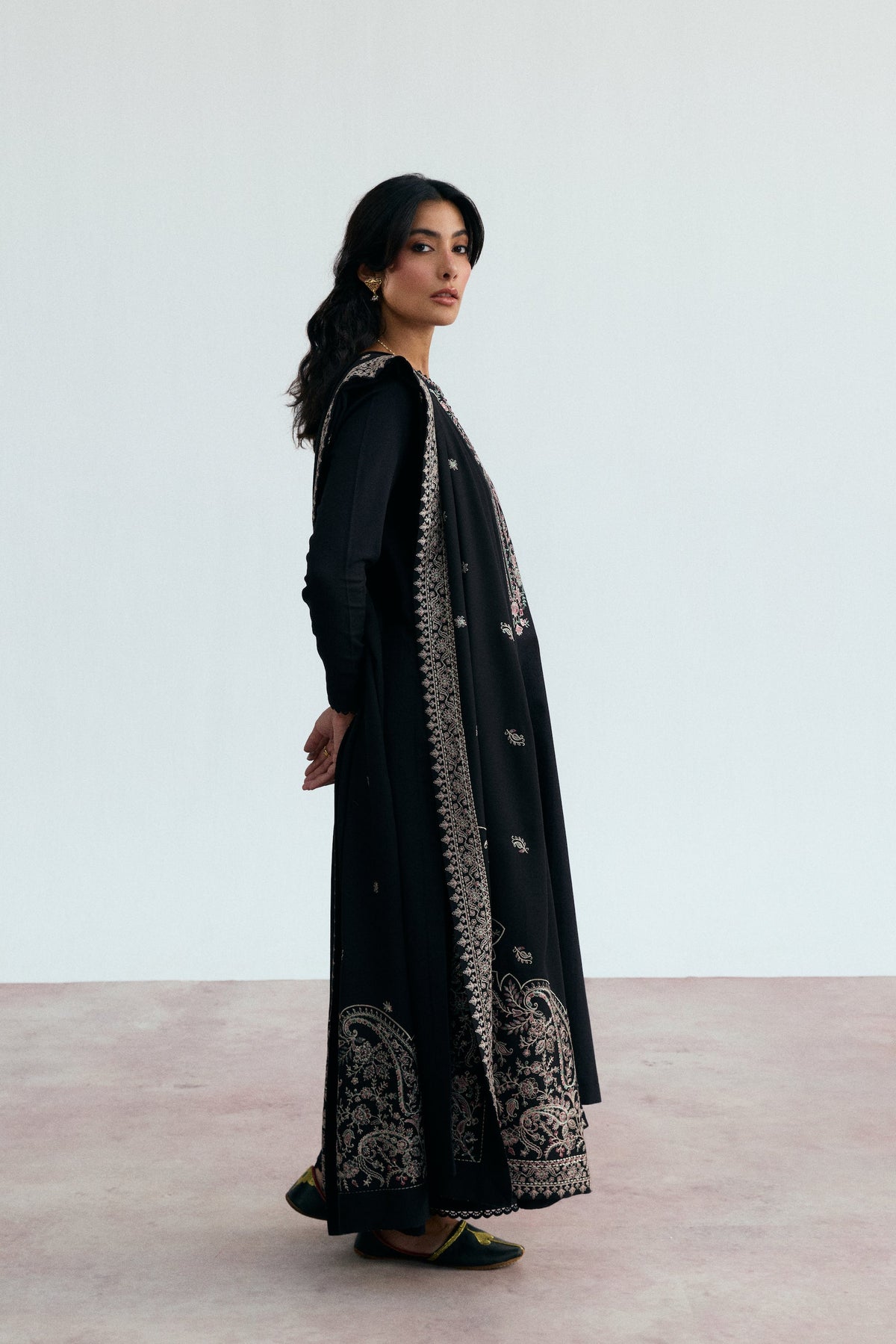 Premium black Pakistani khaddar three-piece suit with heavily embroidered pallu shawl — semi-formal winter wear