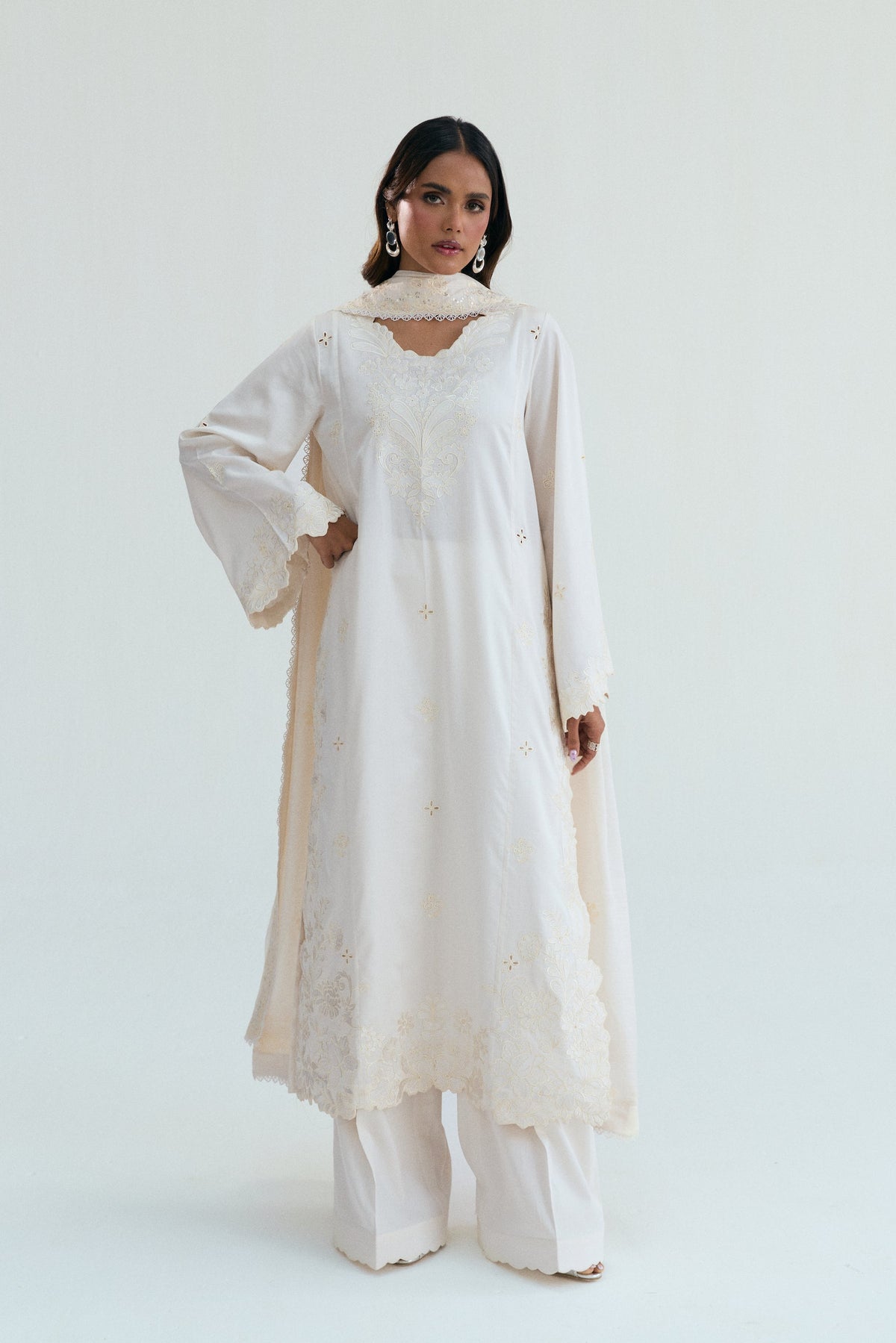 Ivory embroidered cotton Pakistani kameez with wide scalloped sleeves and intricate shiffli floral detailing for Eid and weddings