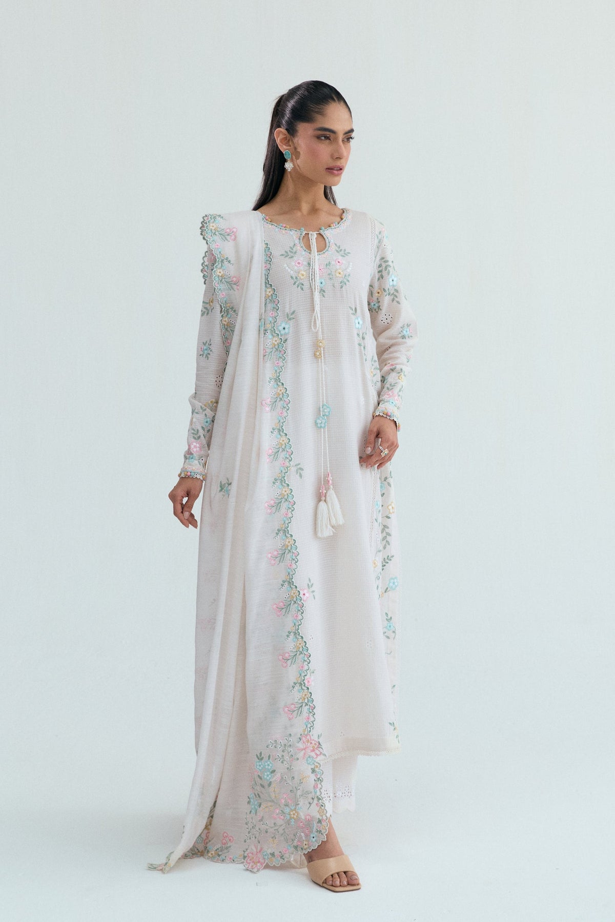 view of off-white 3-piece Pakistani outfit with tonal embroidered trousers