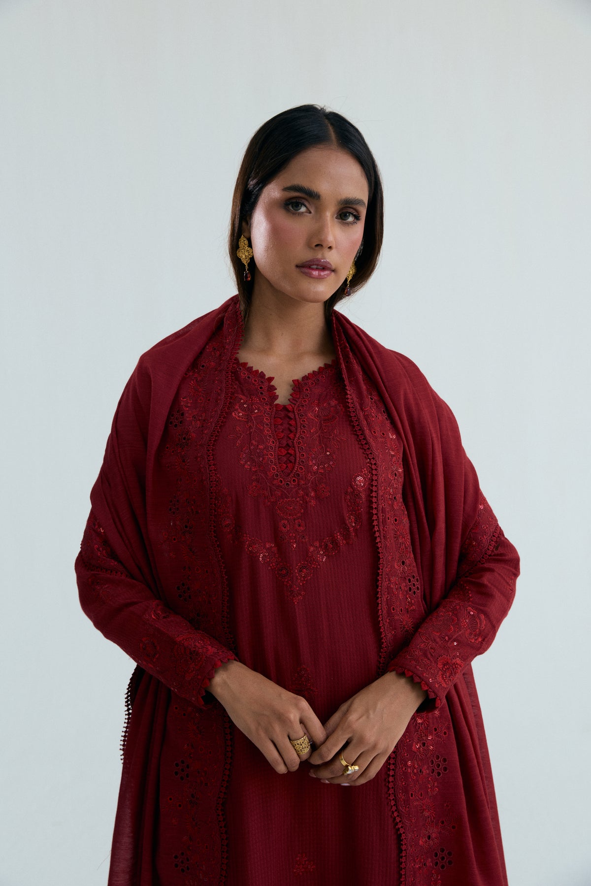 Close-up of embroidery detail on maroon Pakistani cotton kameez neckline