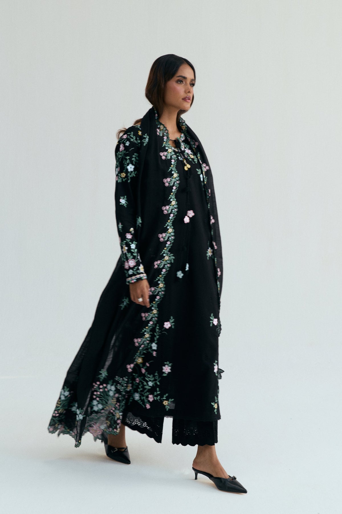 Black Pakistani floral kameez set styled for a summer dawat