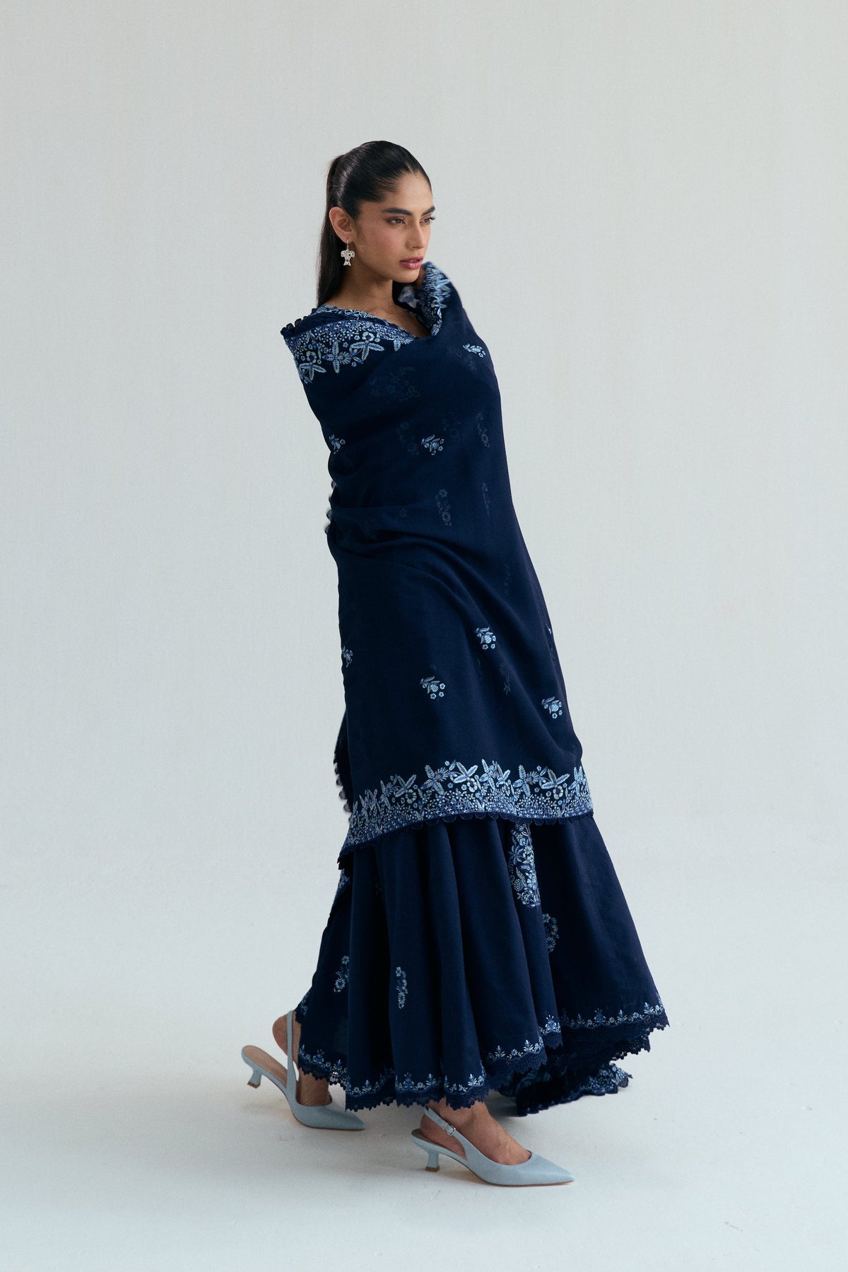 Close view of Sapphire Set neckline showing organza appliqué detailing with subtle sequin shimmer