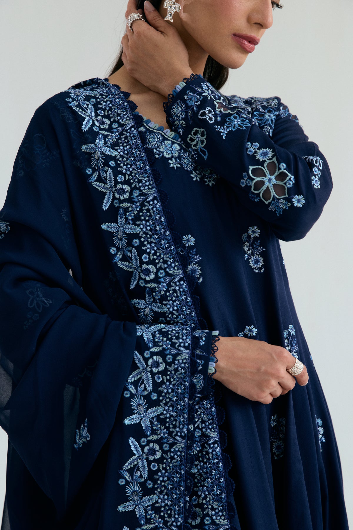 Sapphire blue Pakistani Kalidaar kameez with floral motifs and lace-finished pencil trousers