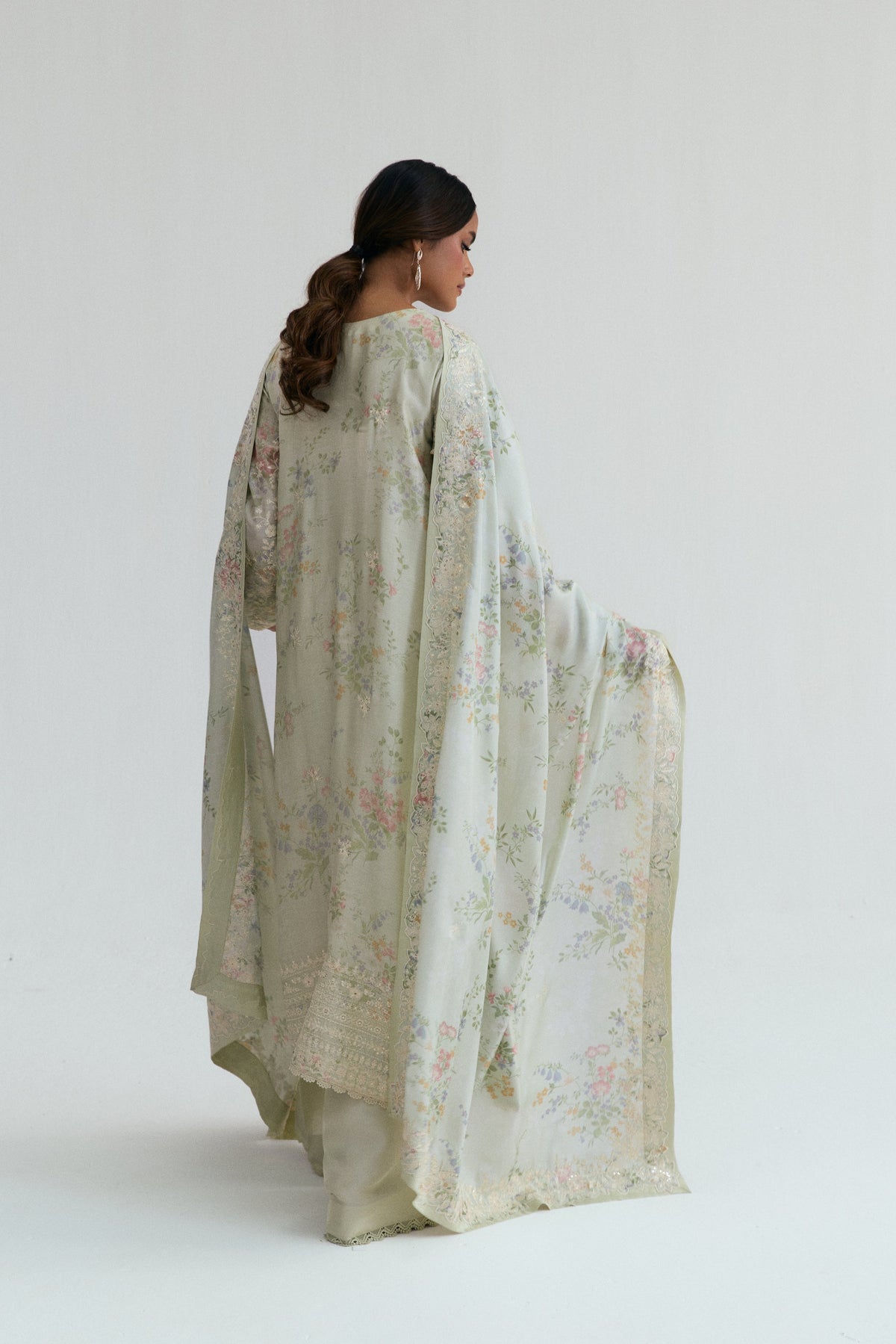 Back view of luxury angrakha silhouette Pakistani formal suit with lace trims and raw silk dupatta,