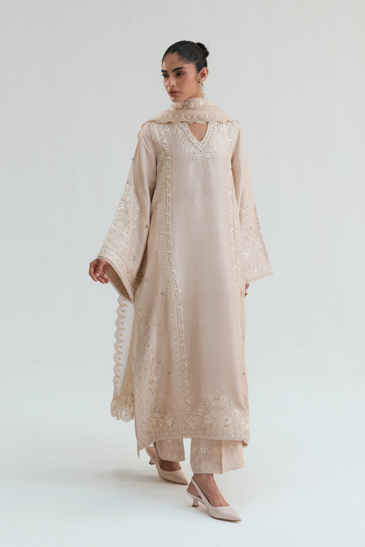 Pakistani women dress with embroidered silk trousers and floral multihead dupatta.