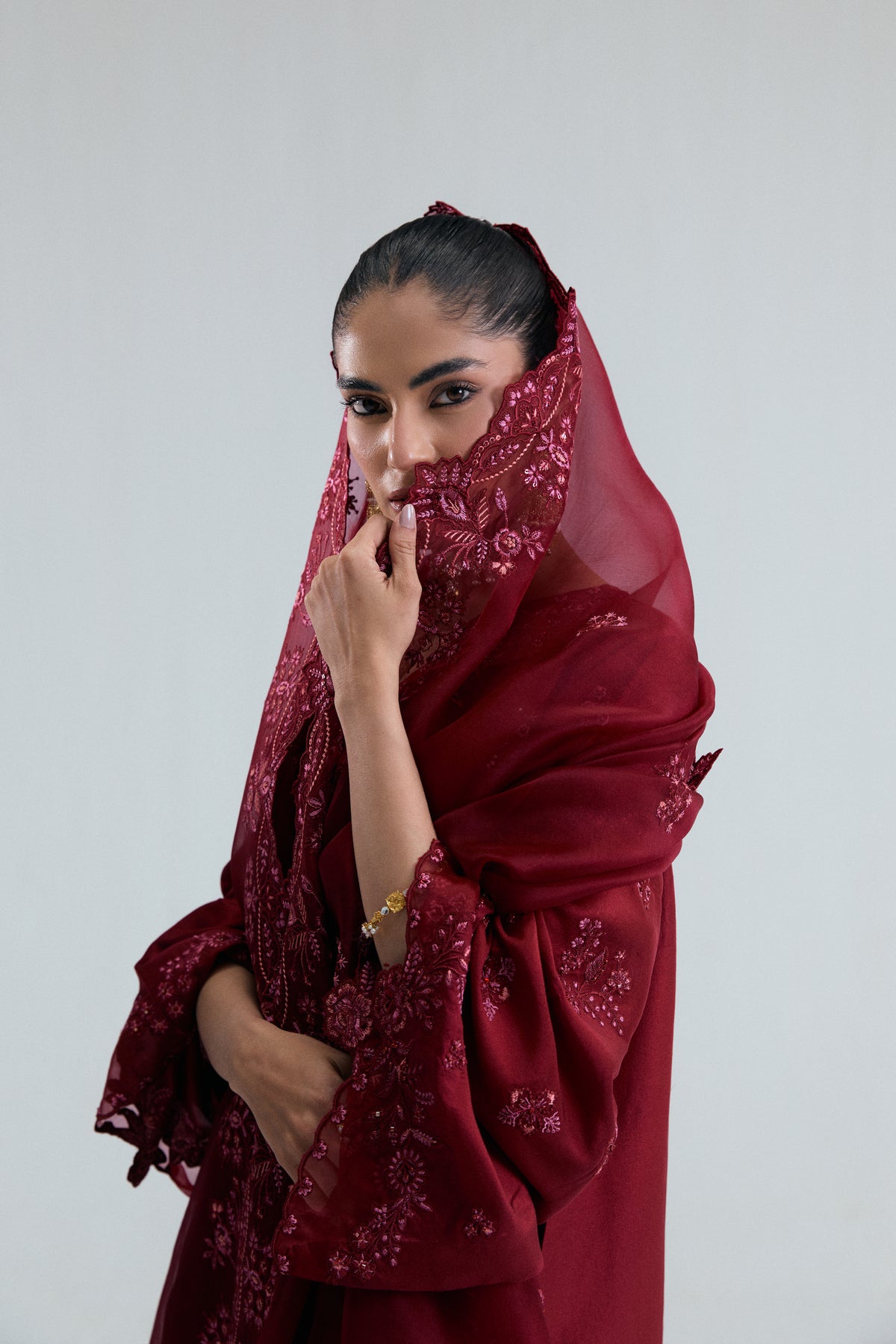 Elegant maroon raw silk long kameez with organza sleeve finishings and metallic thread embroidery by Mannam