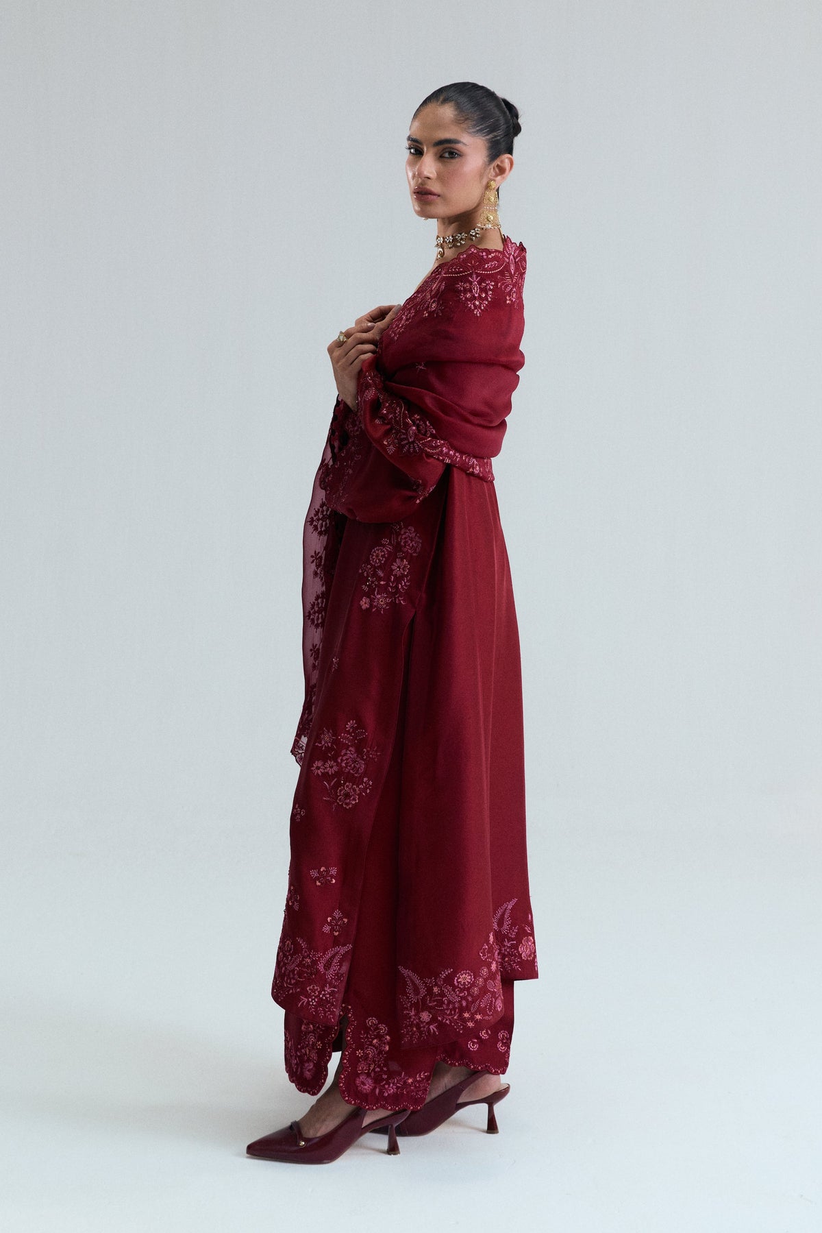 Pakistani maroon raw silk kameez with floral threadwork and straight-leg trousers — luxury pret formal wear UK