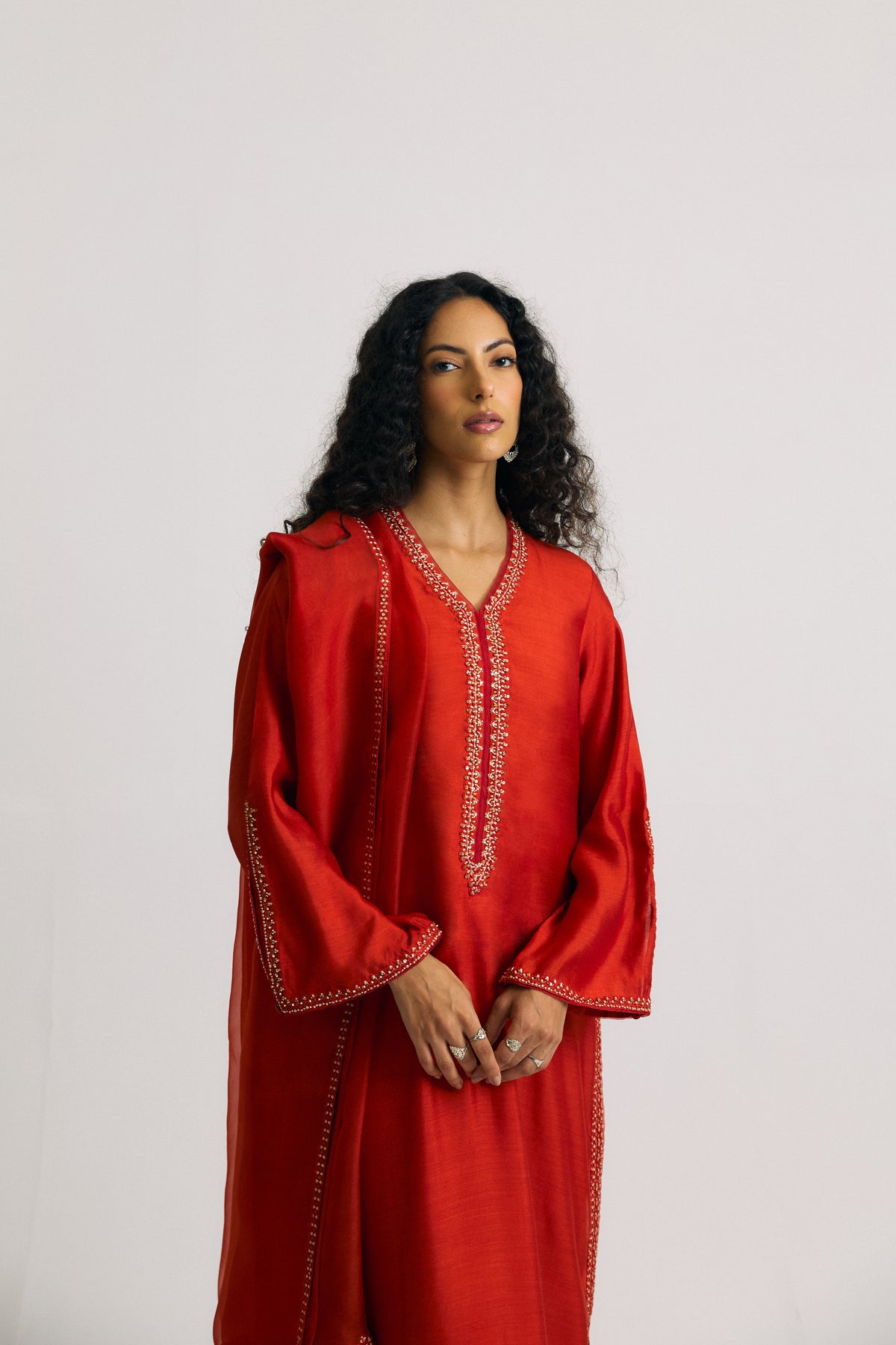 Burnt orange pure silk Pakistani kameez — hand-stitched embroidery and V-neckline with organza trimmings