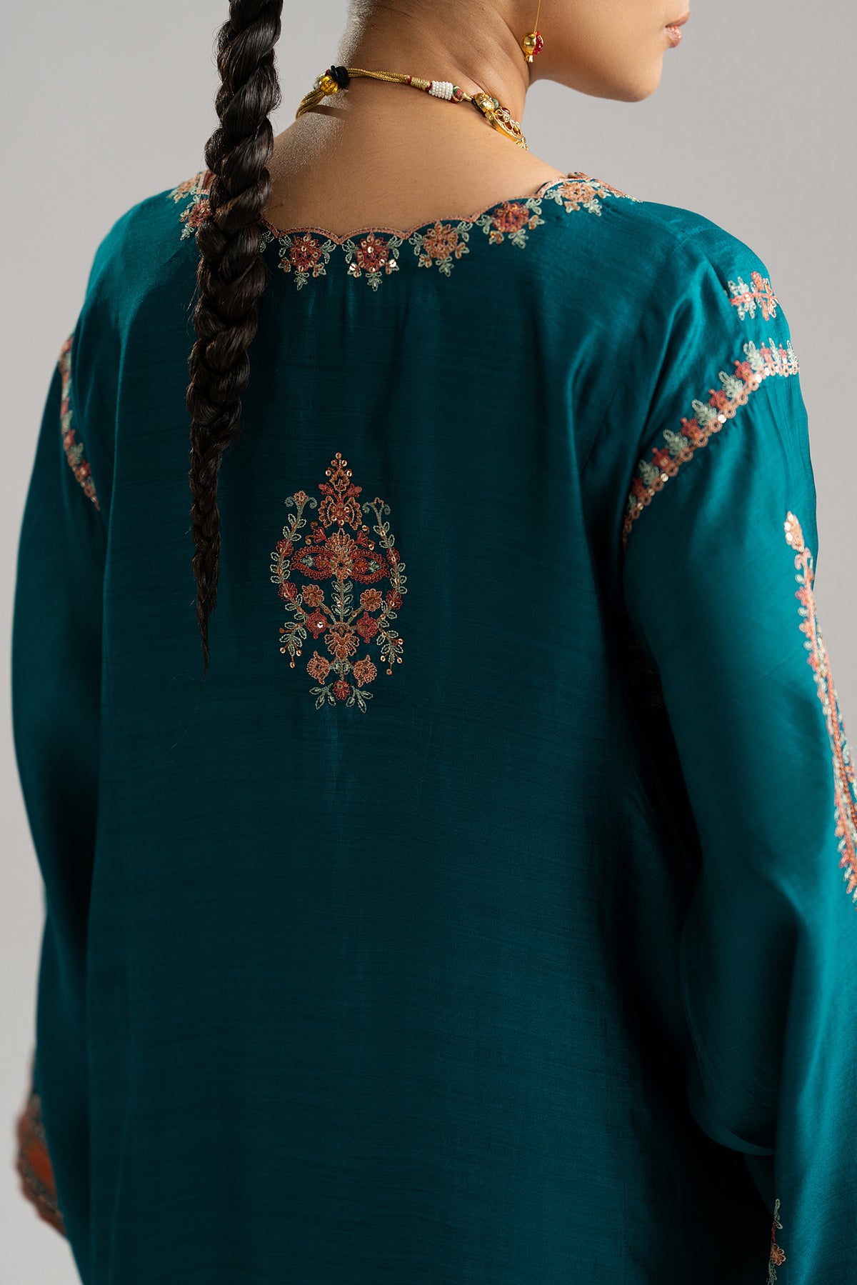 Mannam Afroz teal blue pure silk phiran with Kashmiri embroidery and raw silk trousers
