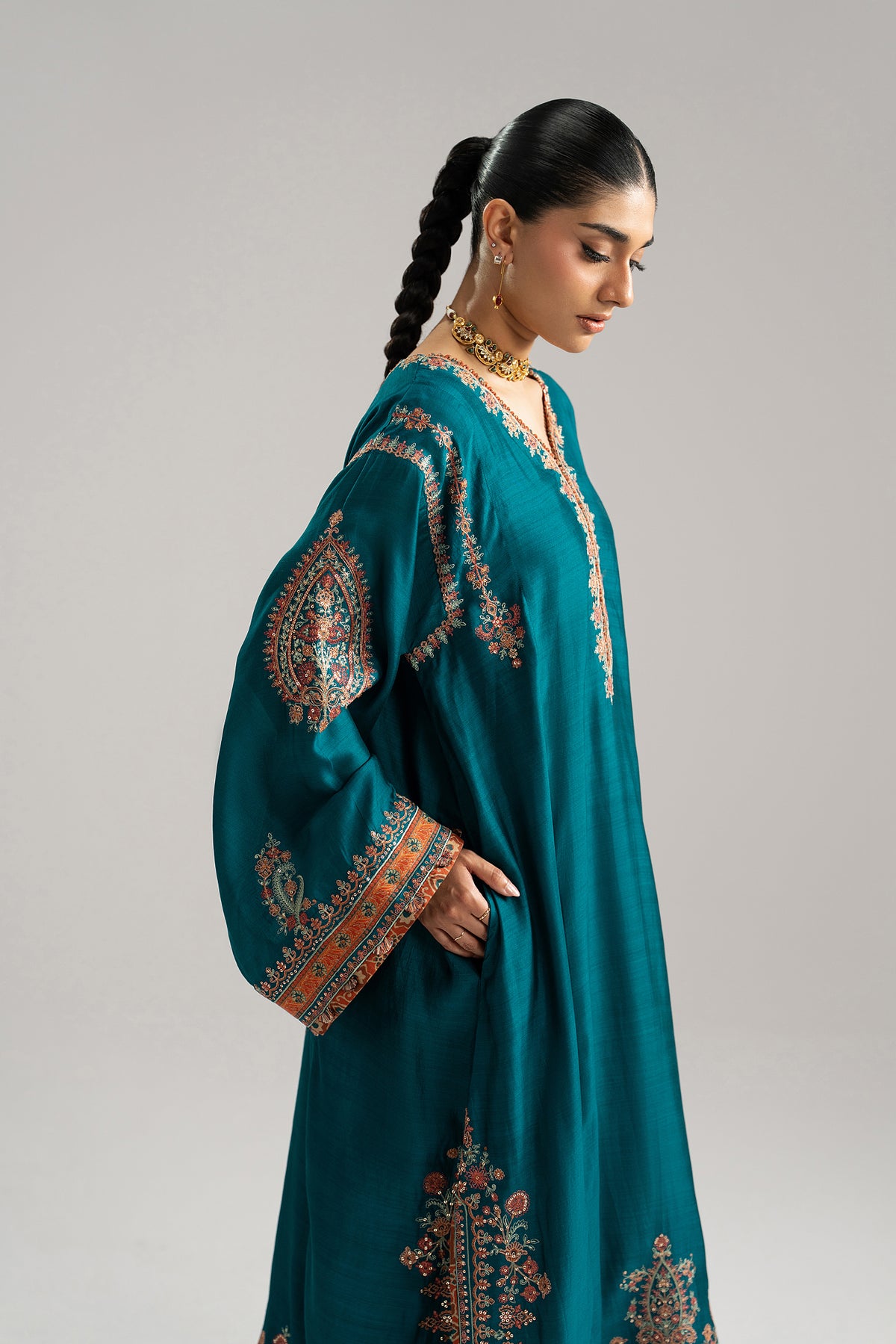 Teal silk Pakistani phiran with intricate Kashmiri-inspired embroidery and sequins — by Mannam