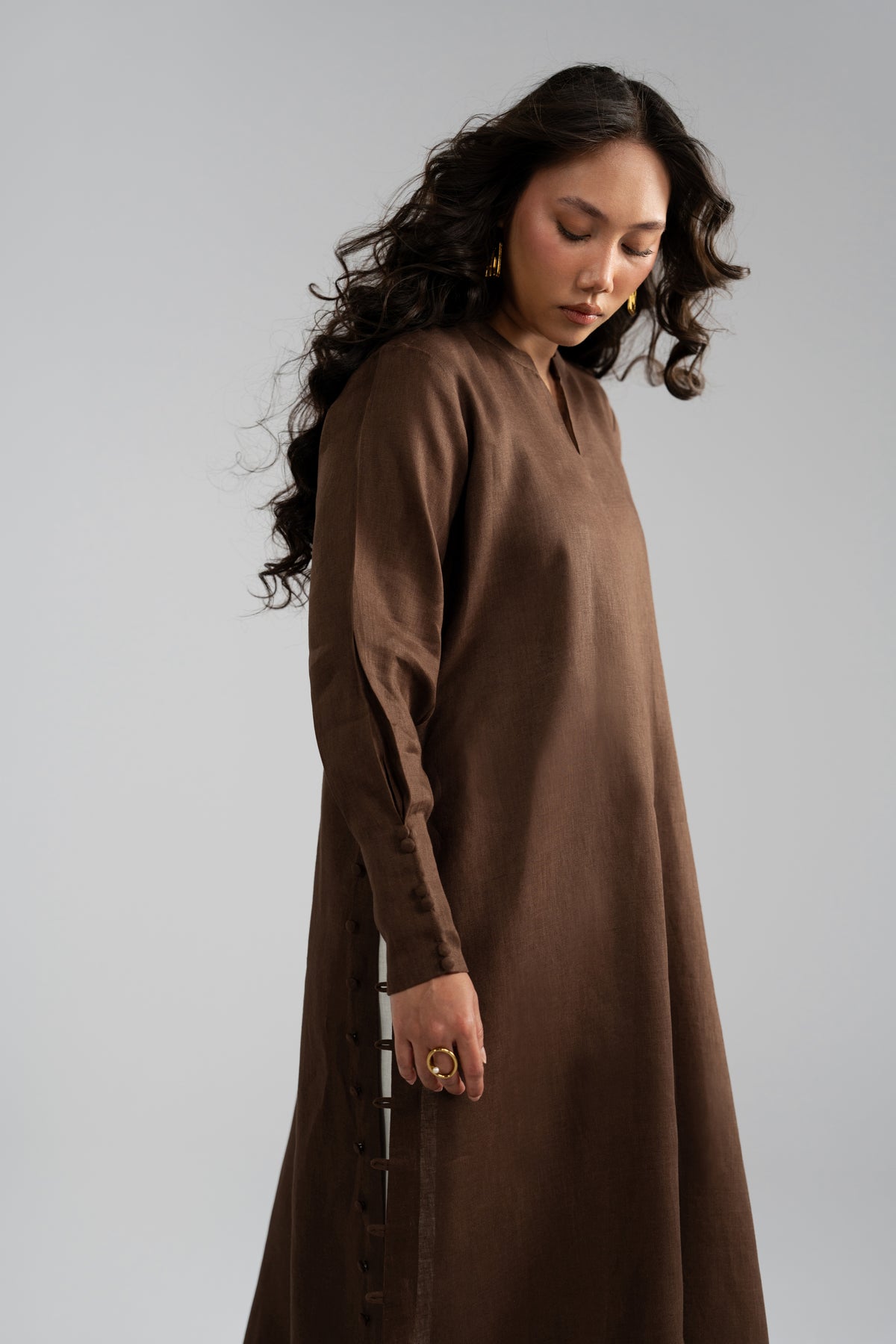 Side view of Mocha Set kameez, model looking down over shoulder