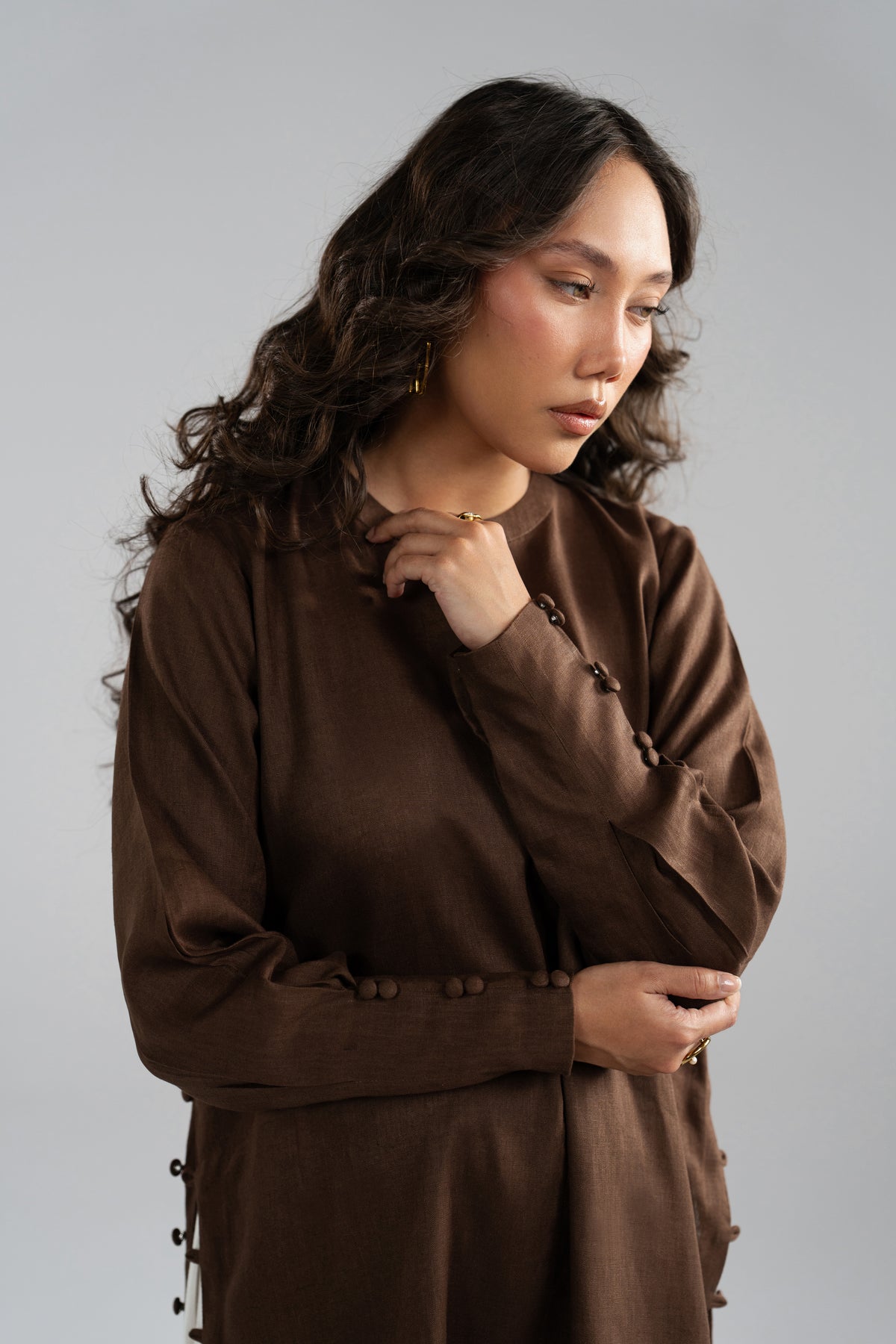 Cuffs designs with having buttons on brown kameez