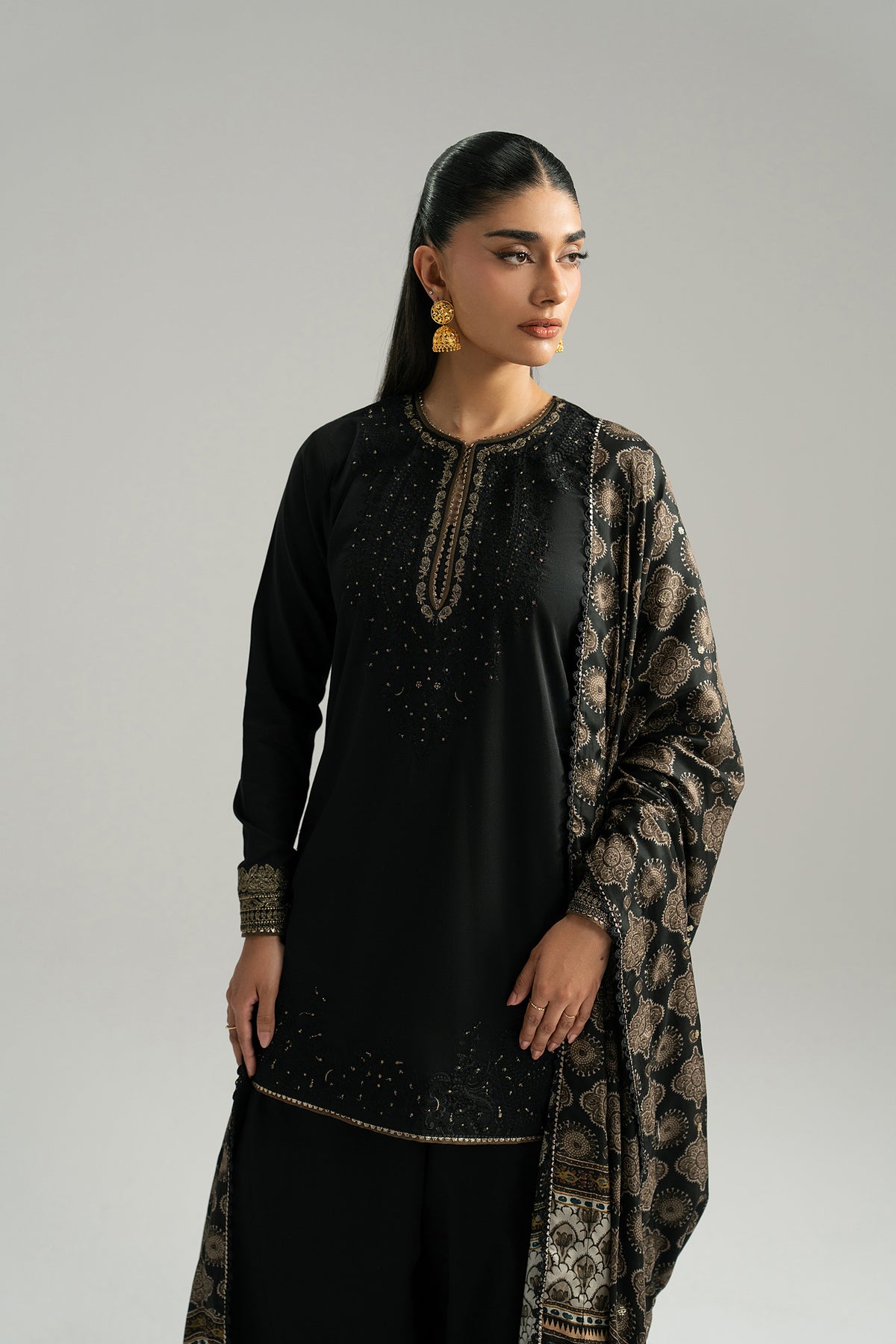 Eclipse Set ajrak dupatta detail — sheesha work and thread tassels on ajrak-inspired silk dupatta