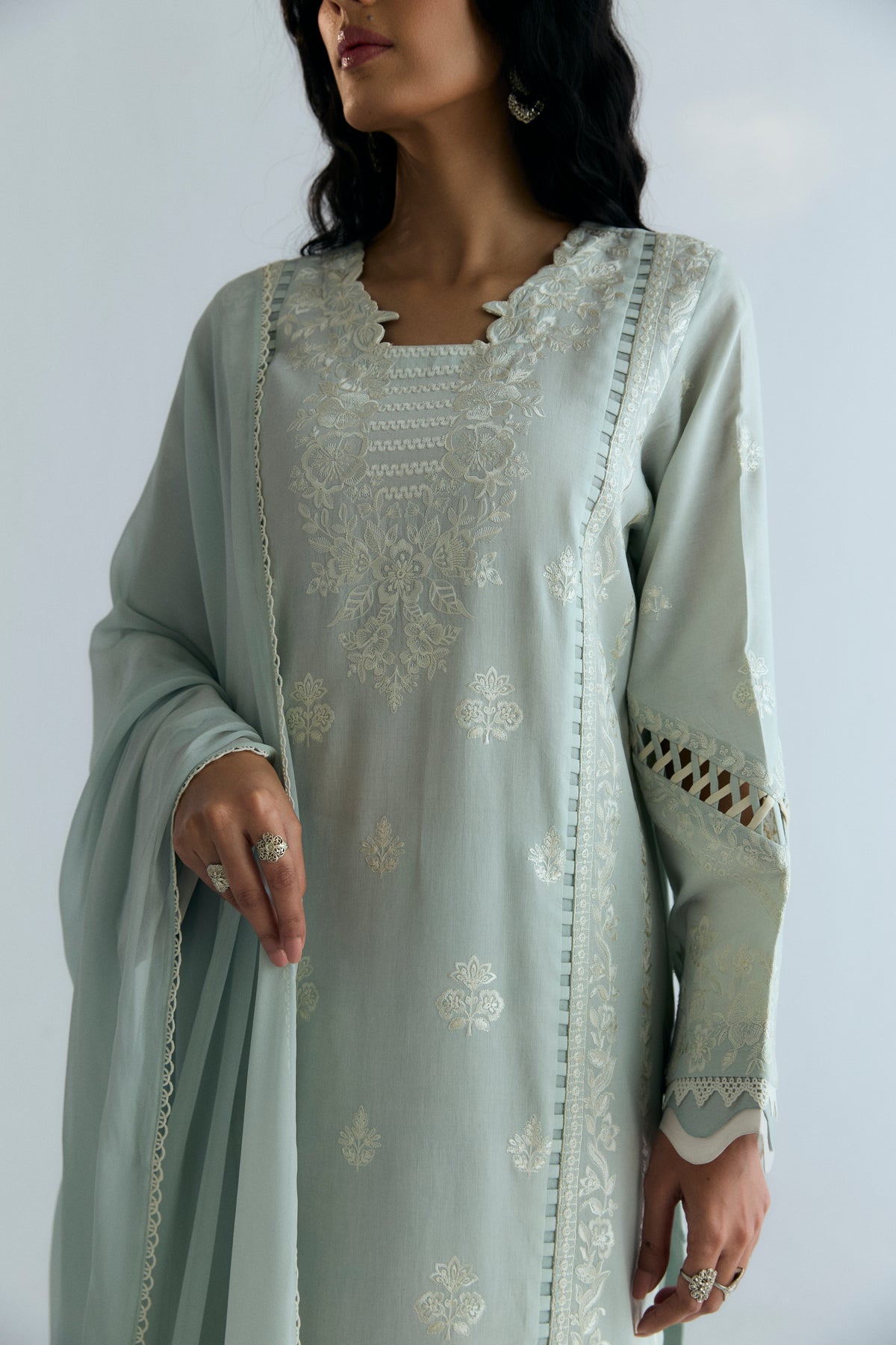 Designer powder blue Pakistani kameez with wide sleeves and scalloped tonal edges — fabric manipulation detail on ethnic wear UK