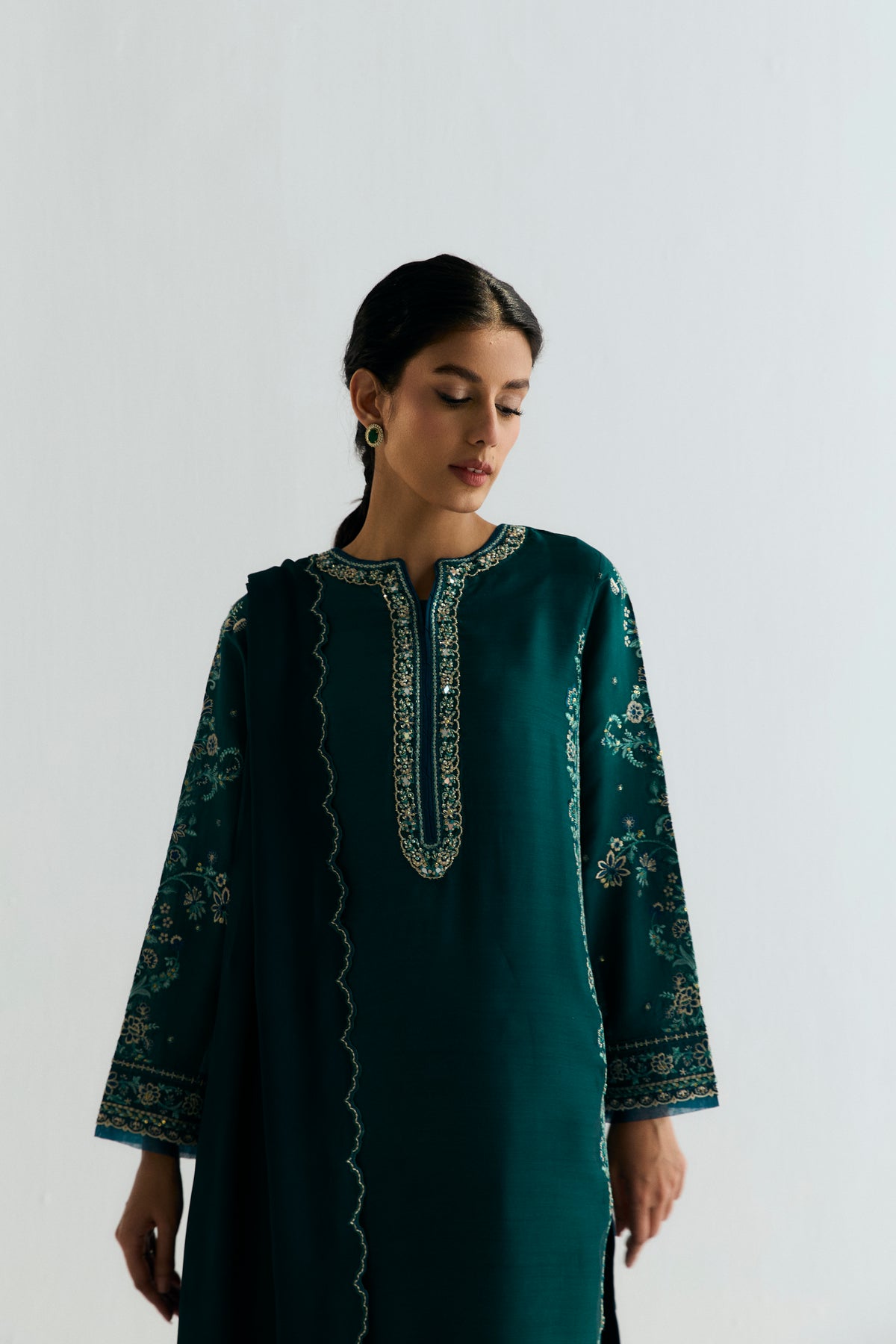 Pakistani designer khaadi silk teal kameez with deeper teal embroidery accents and raw silk pencil trousers