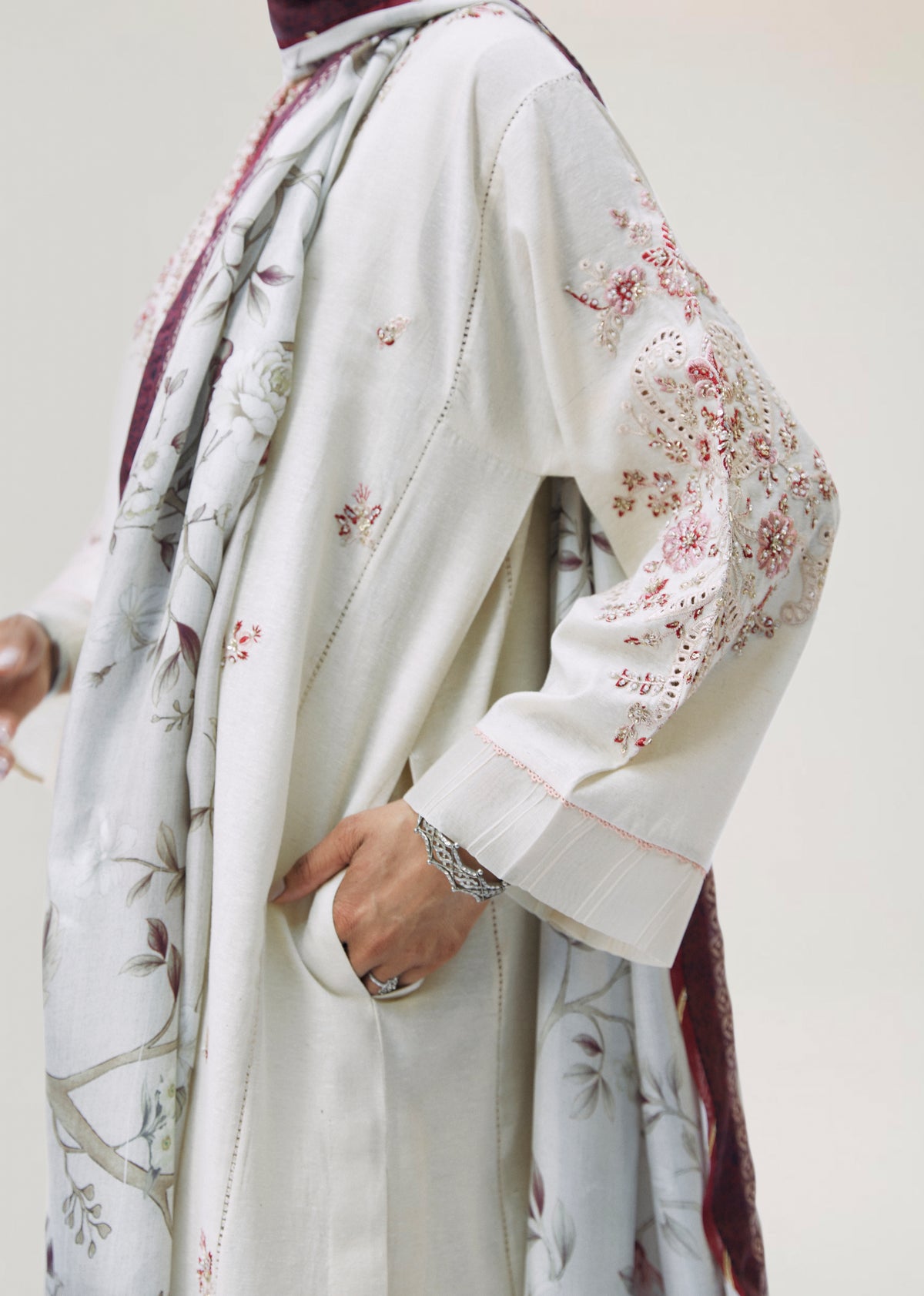 Modern traditional ecru Pakistani kameez suit with floral embellishments and keyhole neckline — formal dress Mannam UK