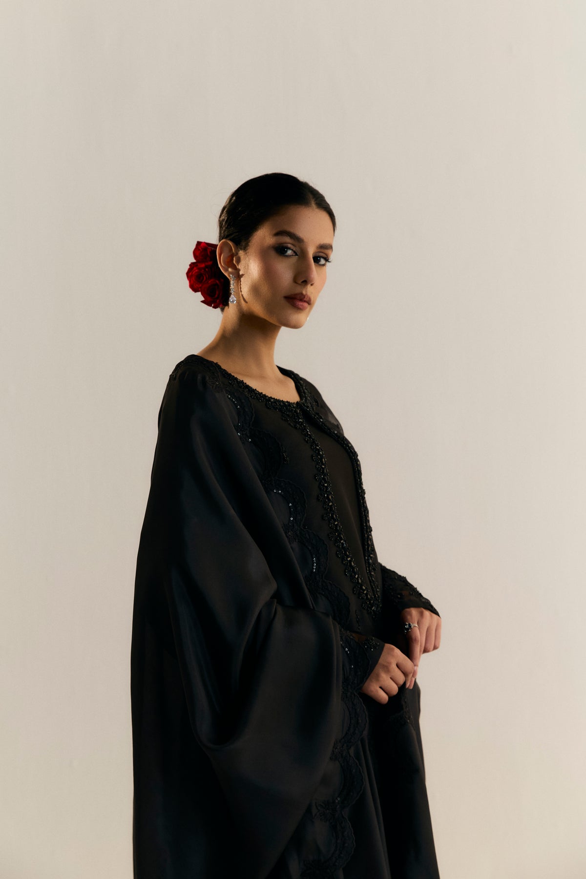 Black organza embroidered kameez with raw silk culotte trousers — luxury Pakistani festive and formal three-piece