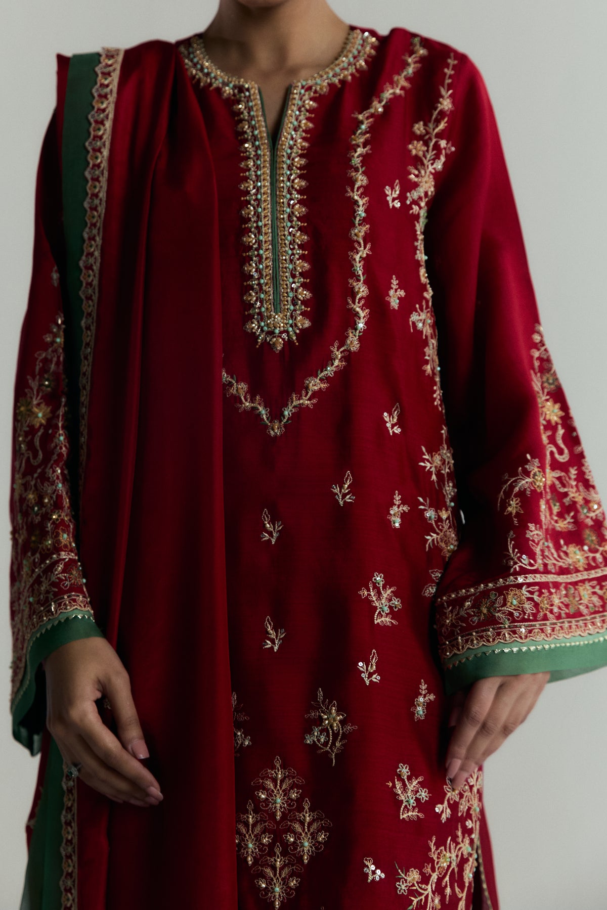 Women wearing Mannam Scarlet Set — red khaadi silk embroidered kameez with gota-lined sleeves and dupatta