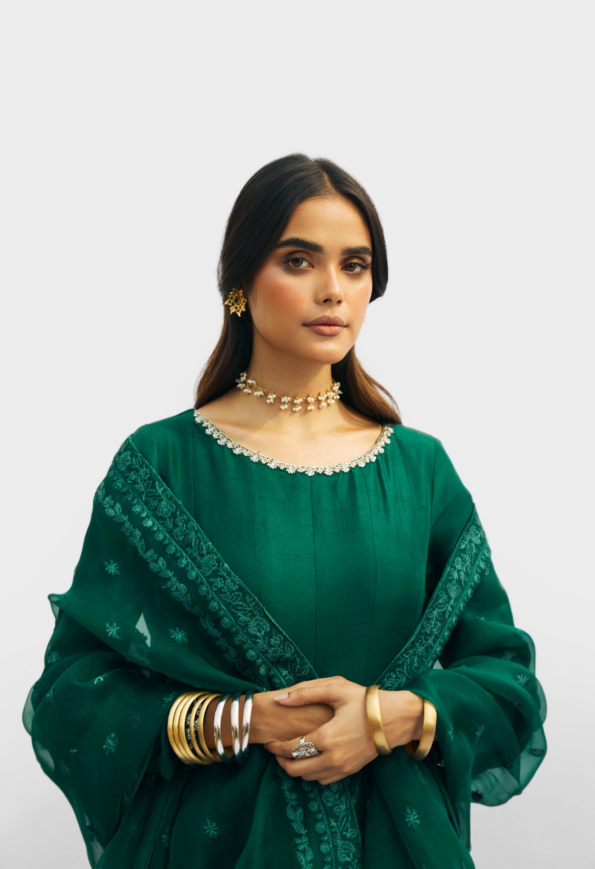Emerald green raw silk peshwas dress — hand-embellished neckline and organza dupatta