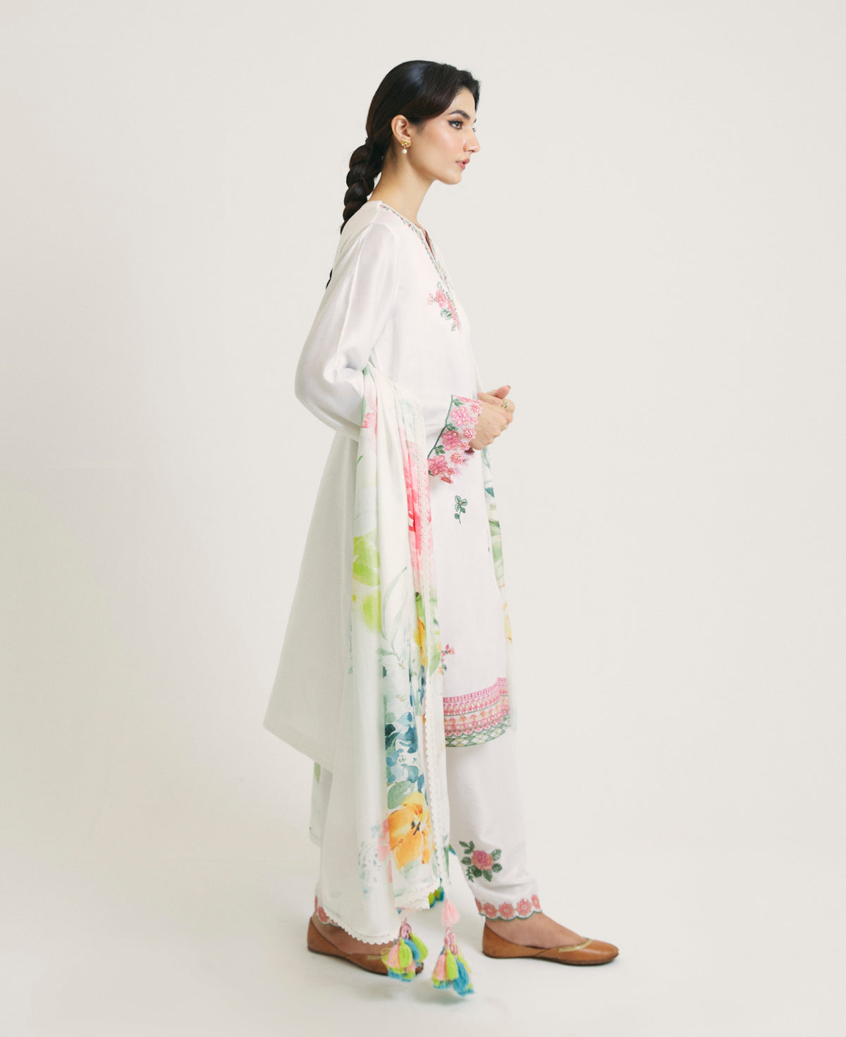 Elegant white Pakistani ethnic wear salwar kameez with all-over floral embroidery and fitted shalwar — designer South Asian suit