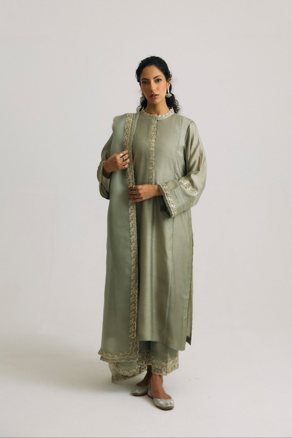 luxury emerald green pure silk Pakistani suit online, featuring lacework panels, sequin embroidery and a silk organza dupatta