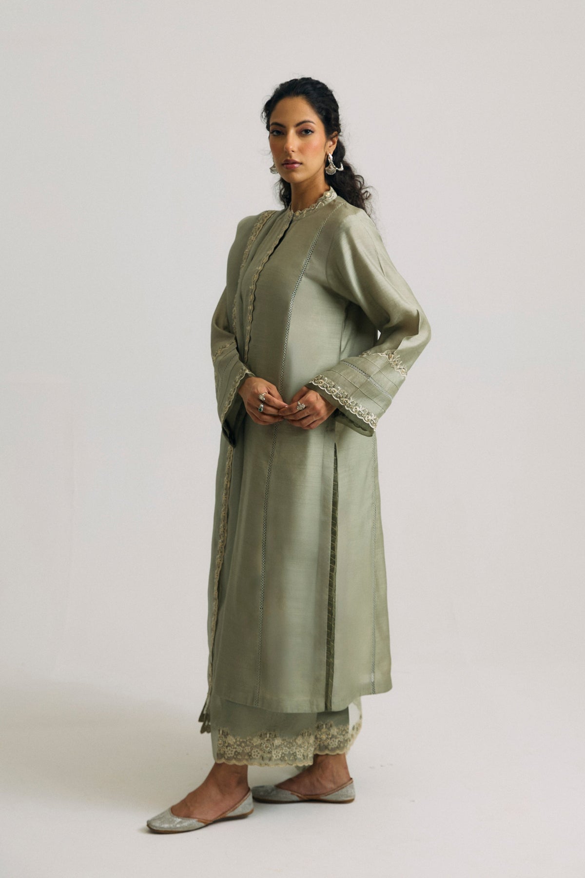 sequin-embroidered silk Pakistani culotte suit in lush green, with lacework panels and organza dupatta