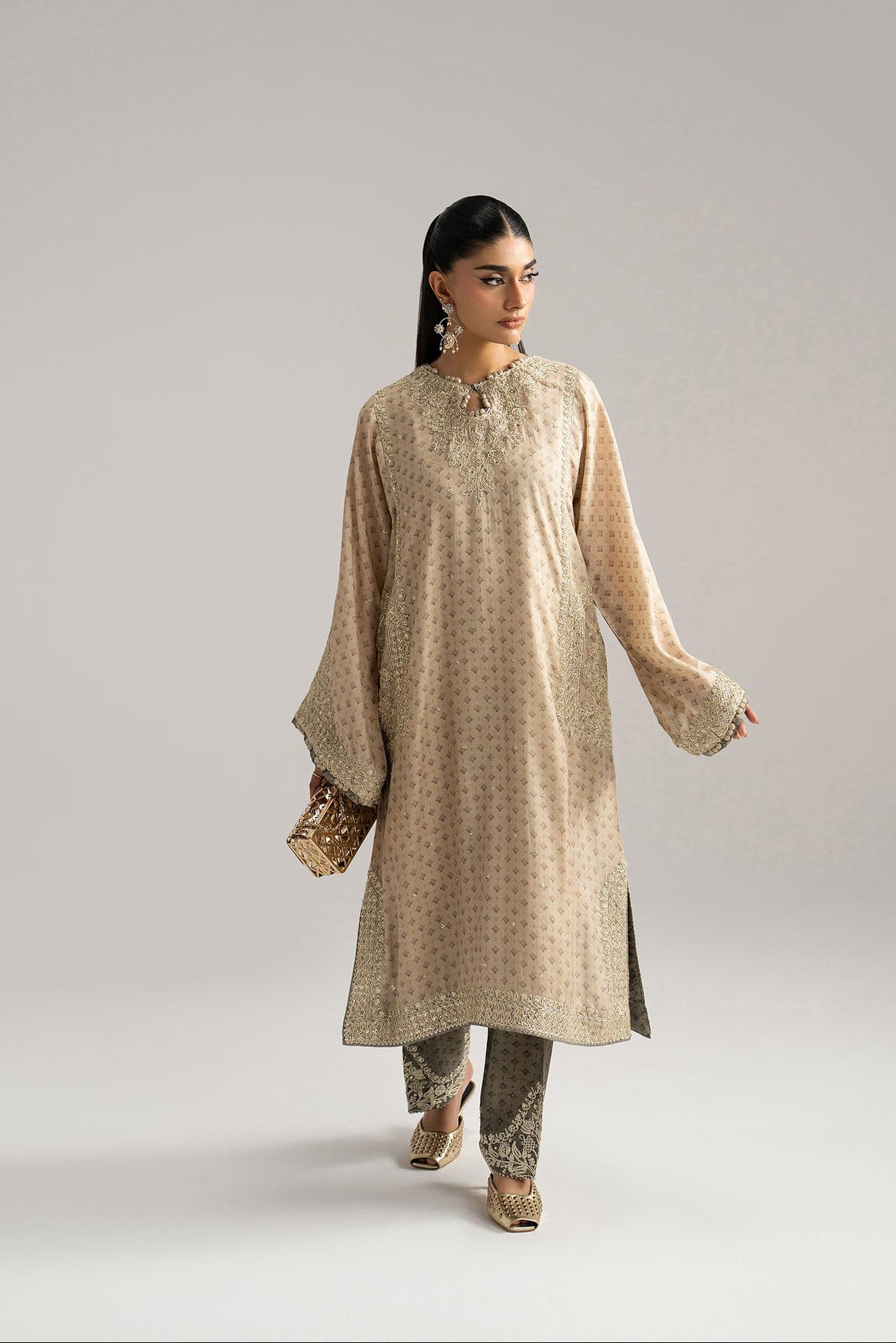 Tilla dori embroidery detail — ivory silk phiran front panel close-up