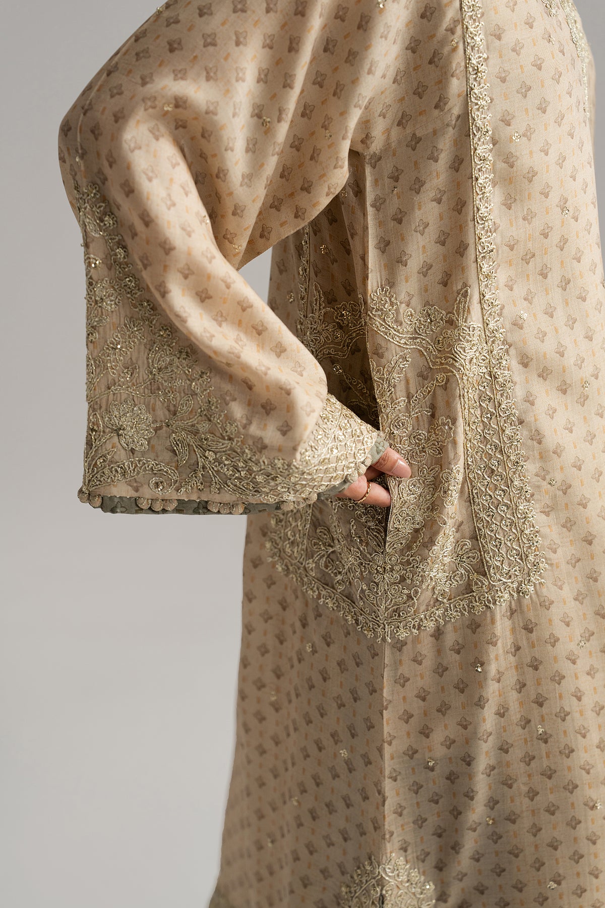 Mannam Taupe Set side view — embroidered fabric bubbles and goti lace on sleeves | Pakistani phiran