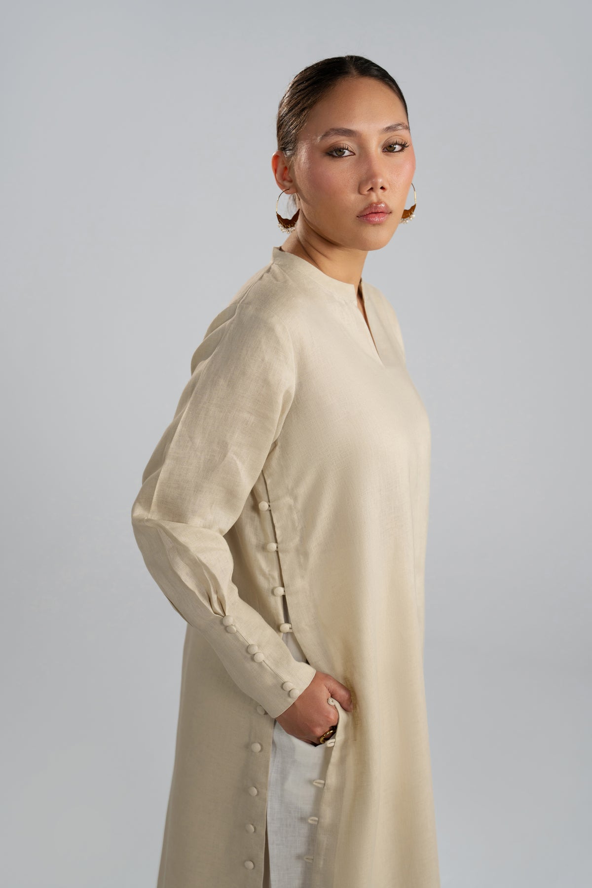 Side profile of Birch Set kameez showing button placket along the front slit
