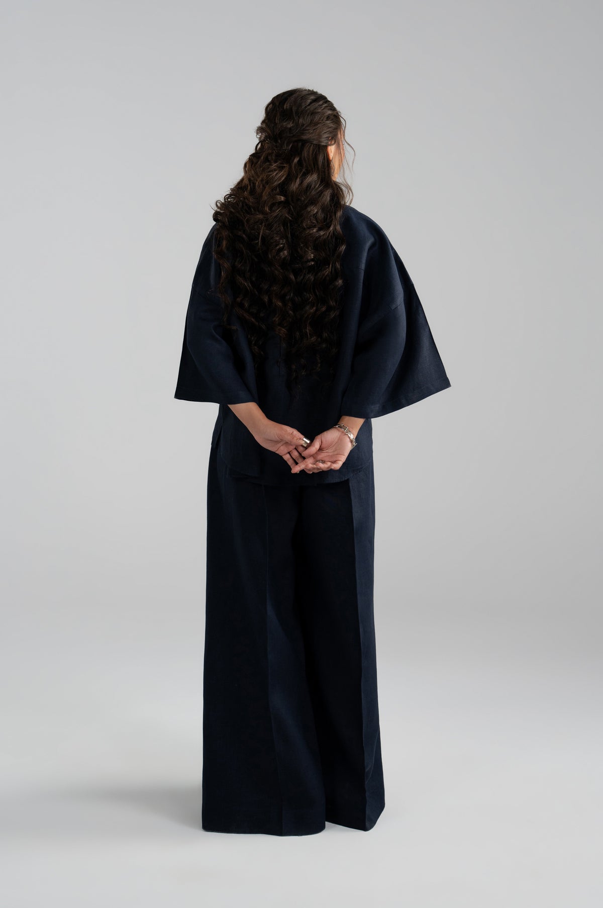 Back view of shirt and wide-leg trousers