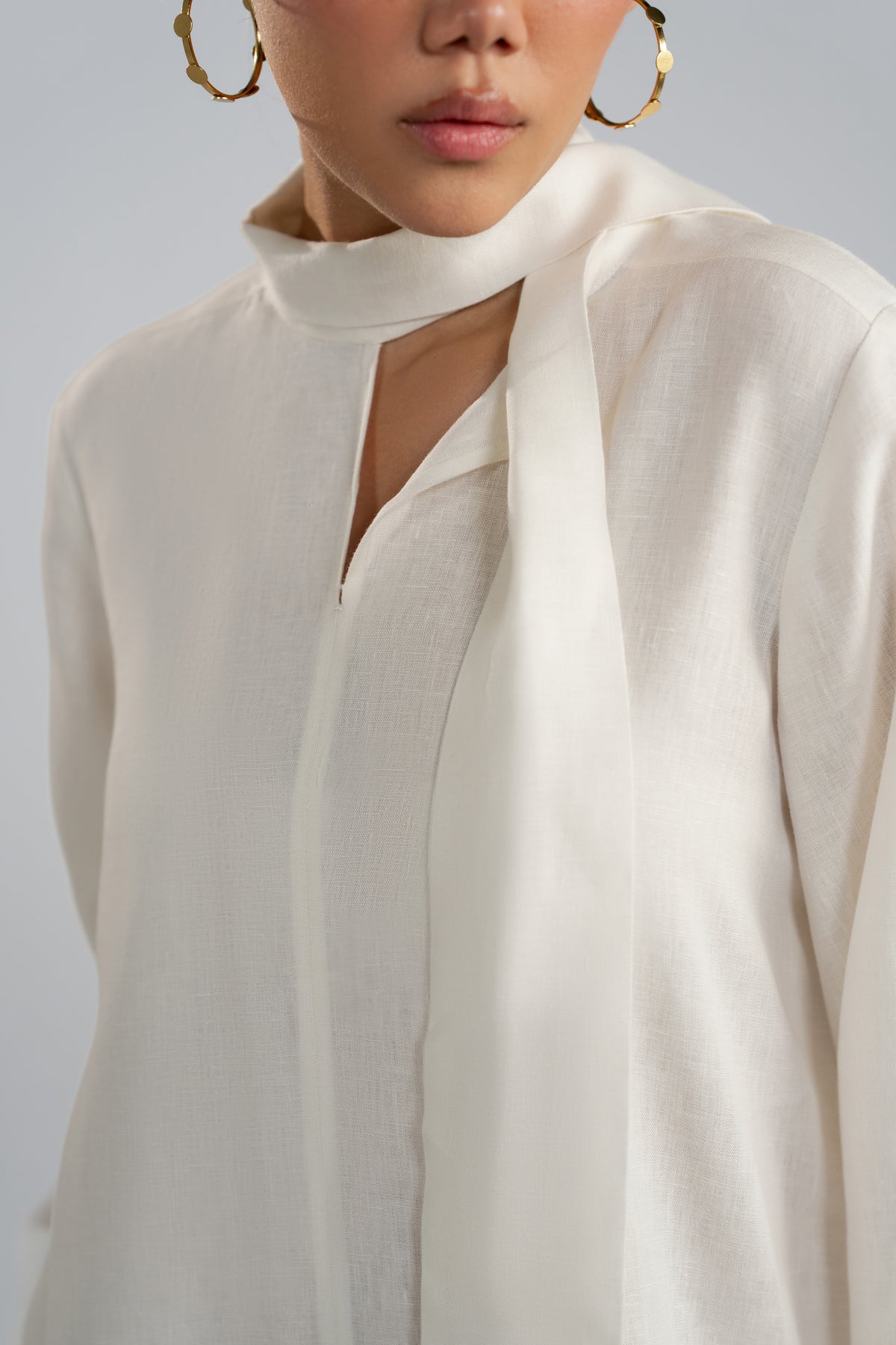 Close-up of Mist Set slit neckline and centre seam stitching