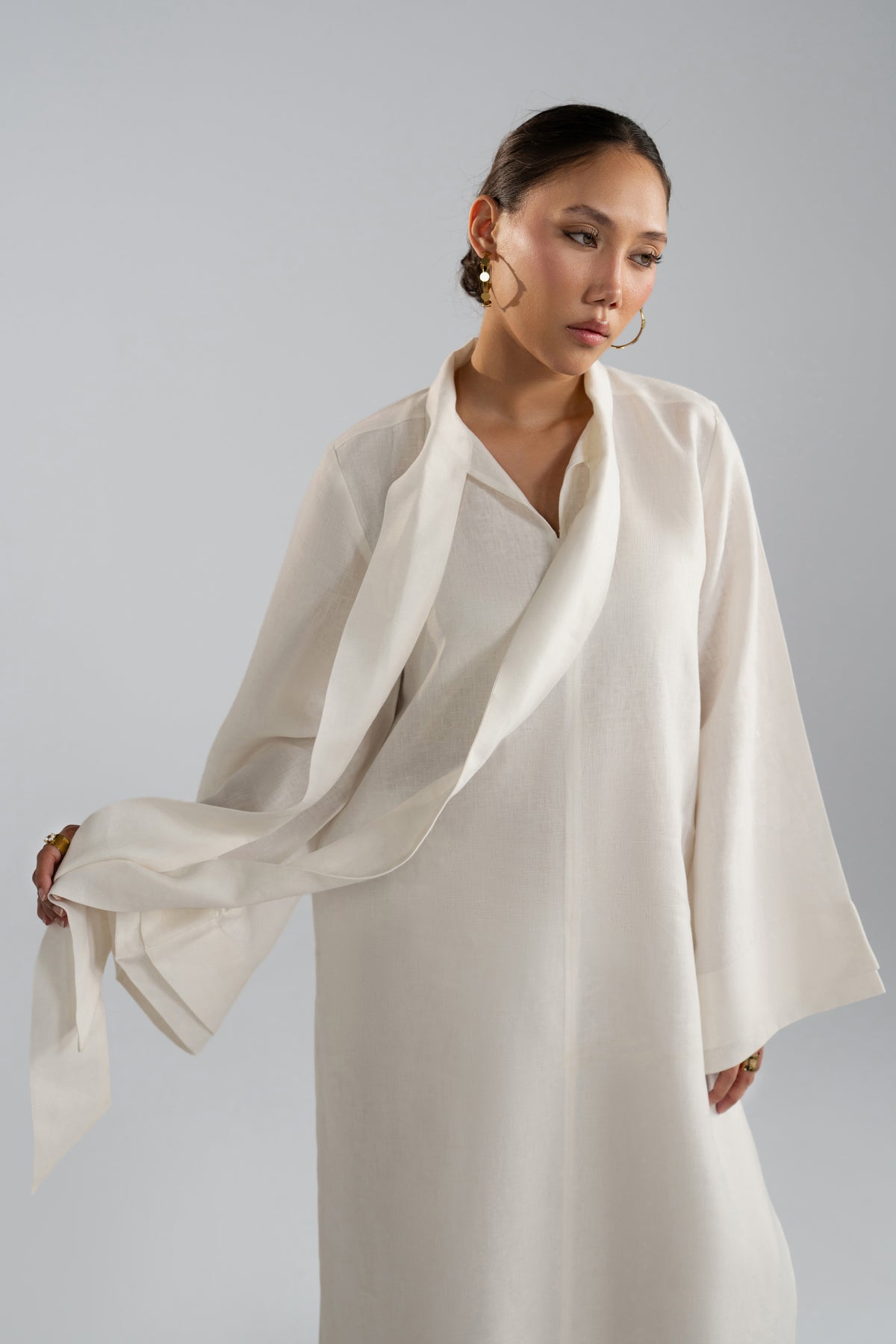 Wrap-style tunic styling on Mist Set, scarf tail detail