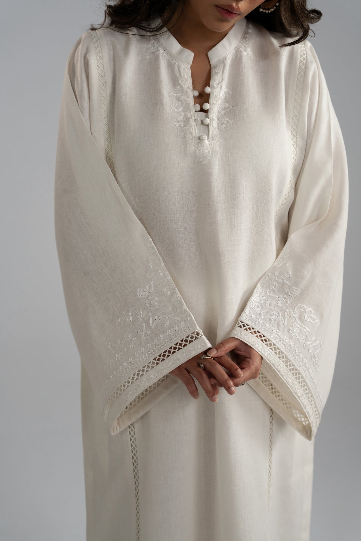 Close-up of Noor Set aari embroidery at the neckline