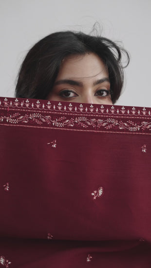Video of Mannam Garnet Set — deep red khaddar Pakistani winter suit with Kashmiri embroidery, straight trousers and tassel shawl