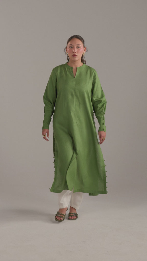Video of model in Fern Set kameez and white shalwar, showing front slit movement
