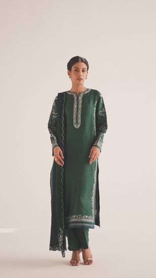 The Teal Set is a pure khaadi silk Pakistani kameez in teal with mirror work and intricate floral embroidery, paired with raw silk pencil trousers — available with free UK delivery from Mannam.