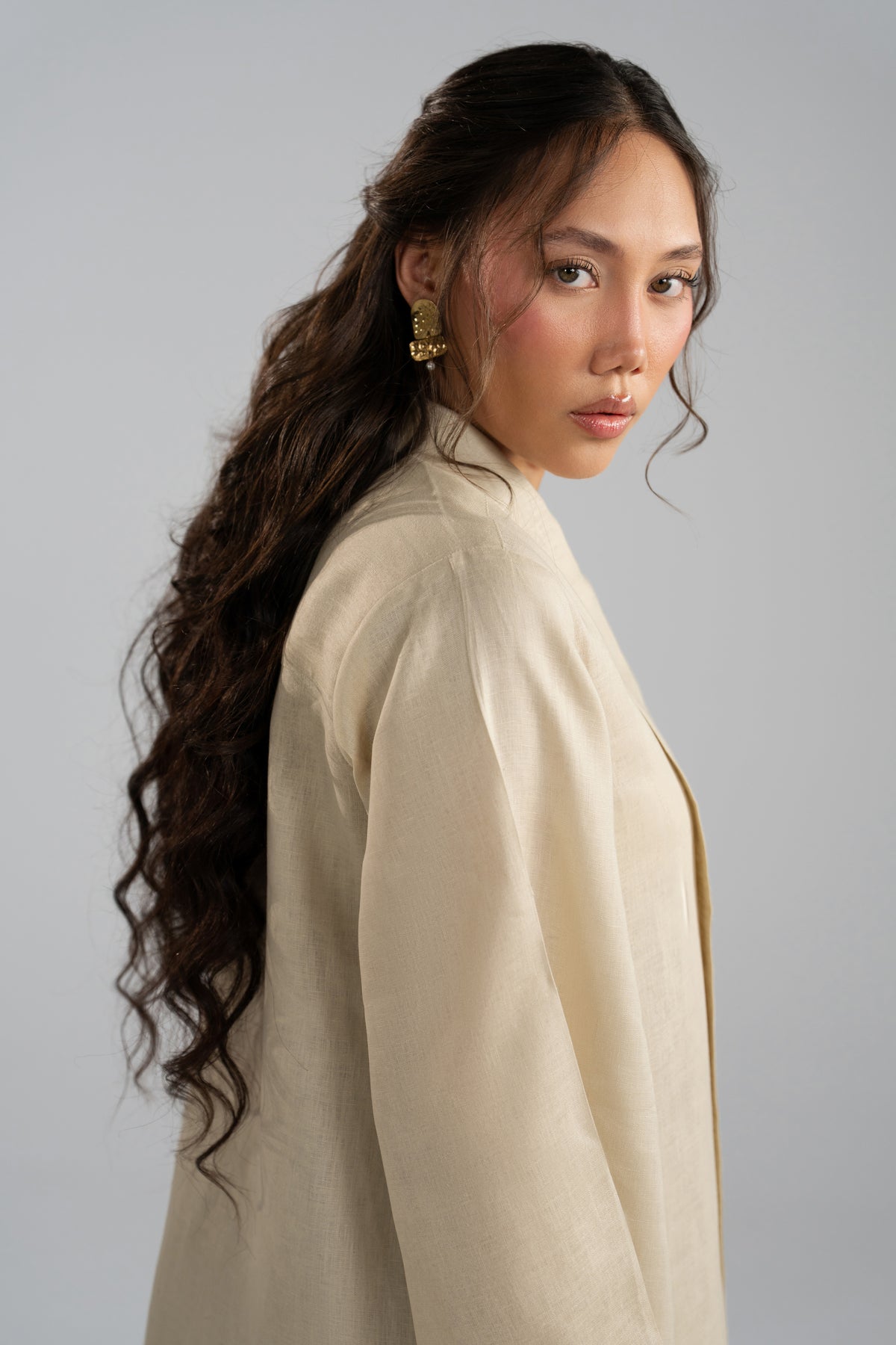 Close-up portrait in Sahara Set tunic, scarf neckline styling
