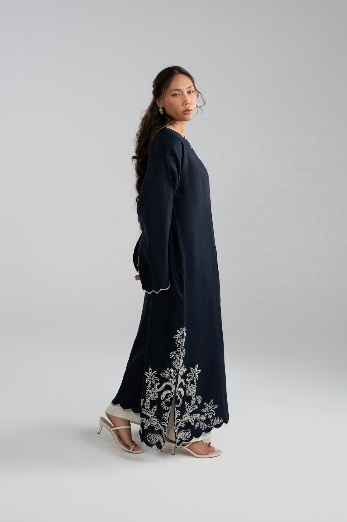 Side profile of Selene Set kaftan, scalloped embroidered hem