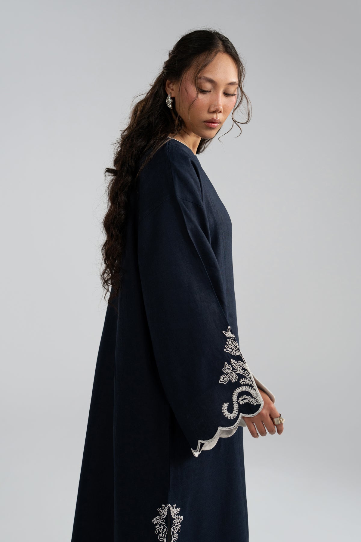 Side view of Selene Set kaftan showing embroidered cuff and hem